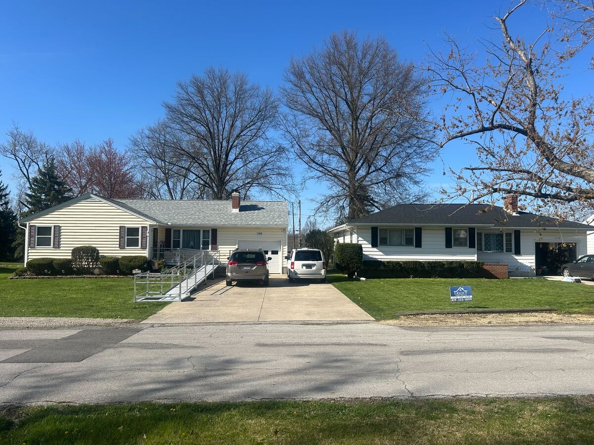 Two completed roof replacements on neighboring homes